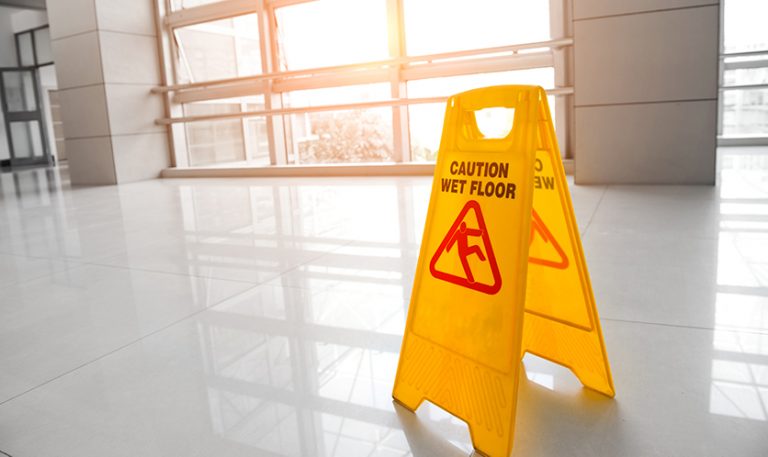 caution wet floor sign in hallway