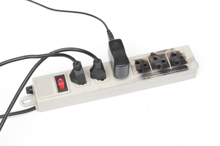 power bar, some outlets with plugs and some outlets are burnt