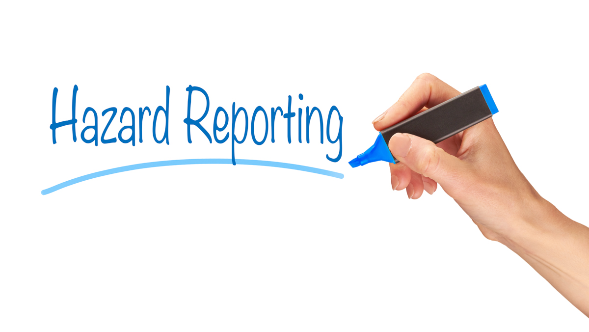 Hazard Reporting title with hand holding pen